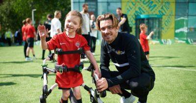Man City star Jack Grealish surprises local kids at football session