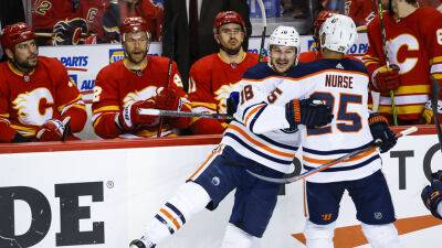 Oilers rally past Flames 5-3 in Game 2 to even series