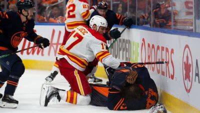 Darryl Sutter - Mikko Koskinen - Mike Smith - Calgary Flames' Milan Lucic ejected from Game 3 loss for charging Edmonton Oilers goalie Mike Smith - espn.com