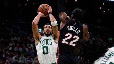 Tatum scores 31 points to help Celtics even series with Heat