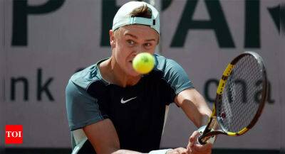 Denis Shapovalov - Holger Rune - French Open: Rising star Rune thumps 14th seed Shapovalov in straight sets - timesofindia.indiatimes.com - France