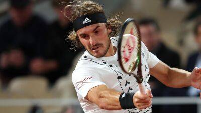 Stefanos Tsitsipas fights back from two sets down to beat Lorenzo Musetti in dramatic French Open match
