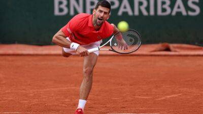 Djokovic keeps French Open title defence on track