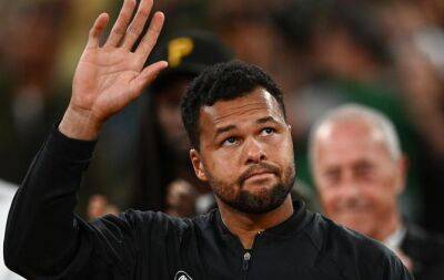 Tsonga says tearful farewell after French Open defeat