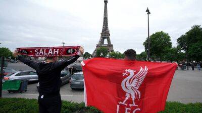 Liverpool fans paint Paris red as Real Madrid players arrive for final - in pictures
