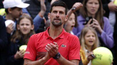 Novak Djokovic advances at French Open after brief second-set stumble