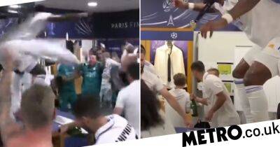 Toni Kroos stops Eden Hazard from pouring champagne into his son’s mouth during Real Madrid celebrations
