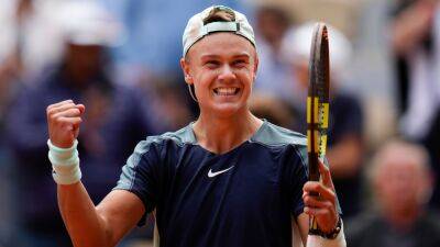 Holger Rune dumps out Stefanos Tsitsipas as young guns shine at Roland Garros