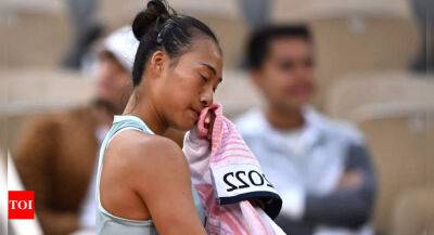 'I wish I was a man,' says China's Zheng Qinwen as stomach cramps end French Open bid