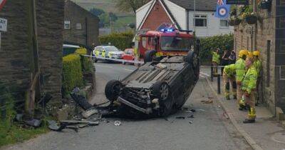 Miraculous escape for driver who walked away with minor injuries after car flipped in horror crash - manchestereveningnews.co.uk