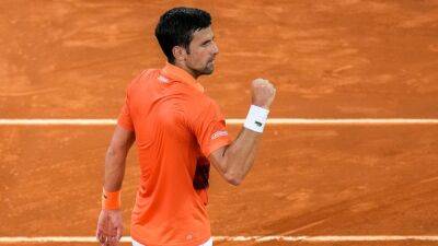 Novak Djokovic sets up Andy Murray clash and remains world number one