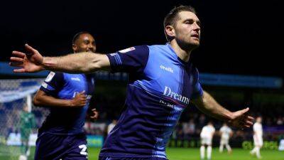 Wycombe claim first leg play-off win over 10-man MK Dons