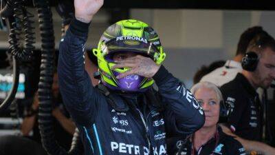 Motor Racing-Defiant Hamilton says piercing will stay