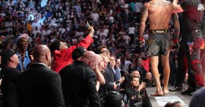 UFC fan tackled to ground after climbing cage following Charles Oliveira fight