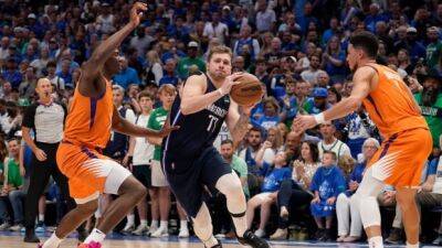 Doncic leads Mavericks to victory, even series as Suns struggle with foul trouble