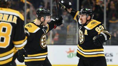 NHL roundup: Brad Marchand's 5 points carry Bruins past Hurricanes