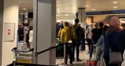 'I've never seen it this bad': Passengers IN TEARS at Manchester Airport chaos as people 'miss flights' amid enormous queues