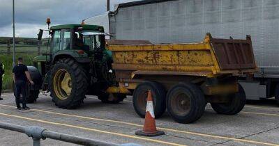 Tractor pulled over by traffic police for driving on the motorway