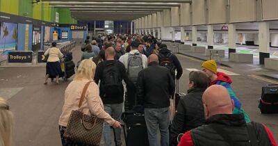 TUI holidays cancelled at 2.30am by text, massive queues and 'three-hour' waits for baggage... the 'carnage' at Manchester Airport is continuing