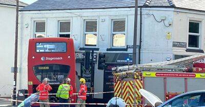 Roads closed and large emergency service presence after double decker bus crashes into building - latest updates