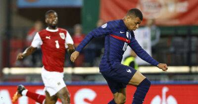 Soccer-Super sub Mbappe salvages draw for France against Austria
