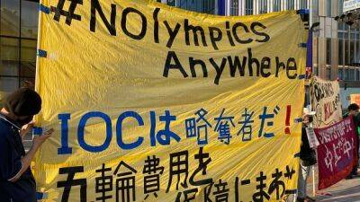 Protesters march through Tokyo, Sapporo opposing 2030 Winter Olympic bid