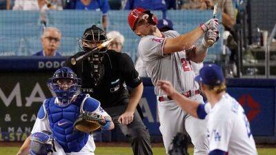 Plate umpire Nate Tomlinson exits Angels-Dodgers game after being struck in face by Mike Trout's broken bat