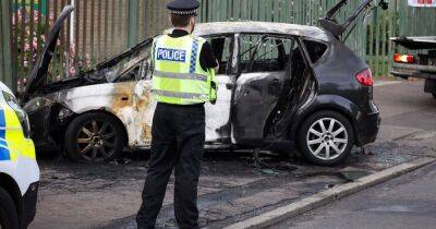 Car wrecked after being engulfed in flames on busy Manchester road