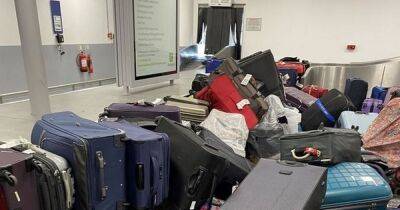 Luggage dumped in huge pile at UK airport amid travel chaos - manchestereveningnews.co.uk - Britain - Italy