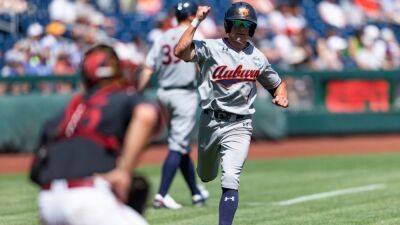 Auburn Tigers, battling stomach bug, rally to eliminate No. 2 Stanford Cardinal at Men's College World Series