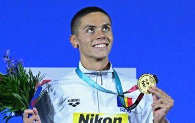 Kylie Masse - Summer Macintosh - Leon Marchand - Teens Popovici and McIntosh grab world swimming golds as Dressel quits - beinsports.com - Usa - Australia - Canada - Romania - county Mcintosh