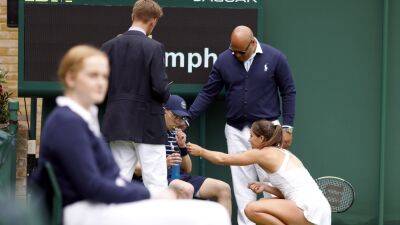 Lesia Tsurenko - Jodie Burrage - Jodie Burrage tends to unwell ball boy during first-round Wimbledon defeat - bt.com - Britain