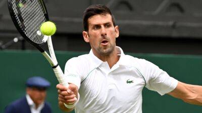 Wimbledon: Novak Djokovic recovers from dropping a set to get title defence off and running