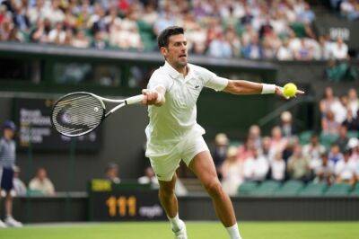 Djokovic survives scare to win 80th match at Wimbledon