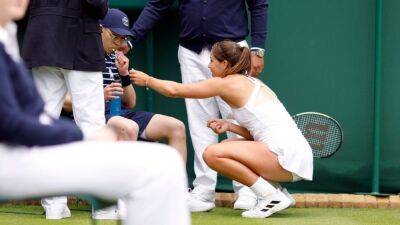 Jodie Burrage halts Wimbledon match to come to aid of fainting ballboy with candy