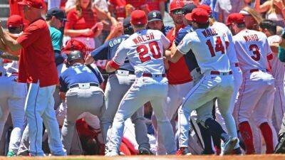 MLB suspends 12 players, coaches for roles in Seattle Mariners-Los Angeles Angels brawl; Phil Nevin gets 10 games