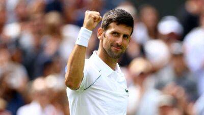 Novak Djokovic 'happy with performance' as Andy Murray exits Wimbledon to John Isner