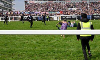 Animal Rebellion protesters run on to track before Epsom Derby