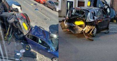 Scene of carnage as driver, 18, seriously injured and homes EVACUATED after Seat Leon smashes into properties and 'several' cars