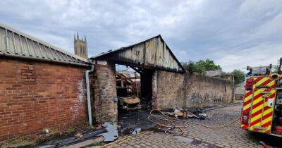 Fire crew remain at scene of huge blaze in Bolton town centre this morning