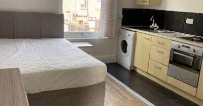 Tiny flat where bed is just inches away from the kitchen costs £425 a month to rent in Greater Manchester