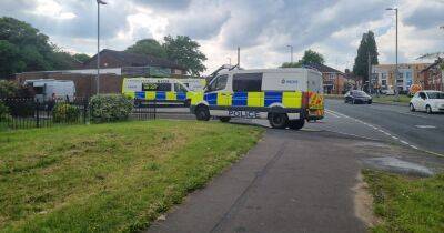 LIVE: Police negotiators attempt to talk man down off roof - manchestereveningnews.co.uk - Manchester
