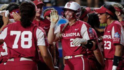 Top-seeded Oklahoma Sooners score 16 unanswered runs in Game 1 win over Texas Longhorns at Women's College World Series