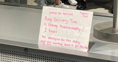 "Is this a joke?": Makeshift sign warns Ryanair passengers of two-hour wait for baggage at Manchester Airport