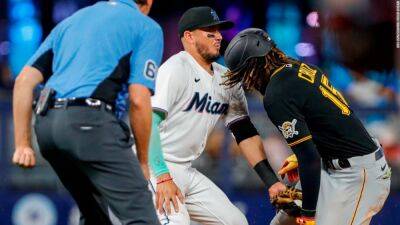 Marlins shortstop gets tooth knocked out but Miami claims a walk-off victory in the 11th - edition.cnn.com - county Anderson