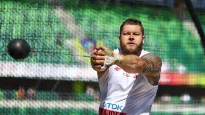 Polish hammer rivals Fajdek, Nowicki advance as worlds get subdued start