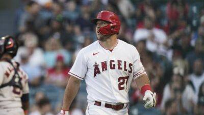 Angels' Trout (back) scratched moments before first pitch