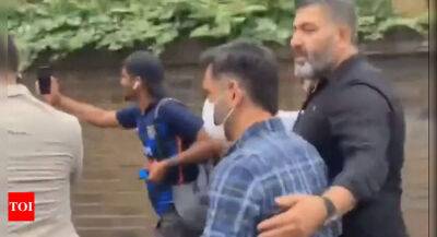 Watch: Fans chase MS Dhoni, take running selfies with him in London