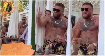 Paddy Pimblett - Conor Macgregor - Dustin Poirier - Gary Neville - Conor McGregor reacts angrily to hat being thrown at him - givemesport.com