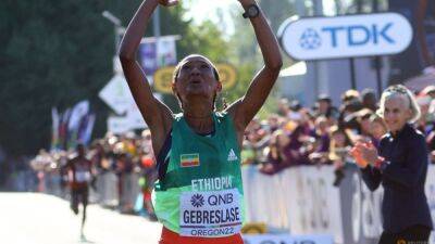 Gebreslase wins world marathon title in championship-record time - channelnewsasia.com - Ethiopia - Israel - Kenya